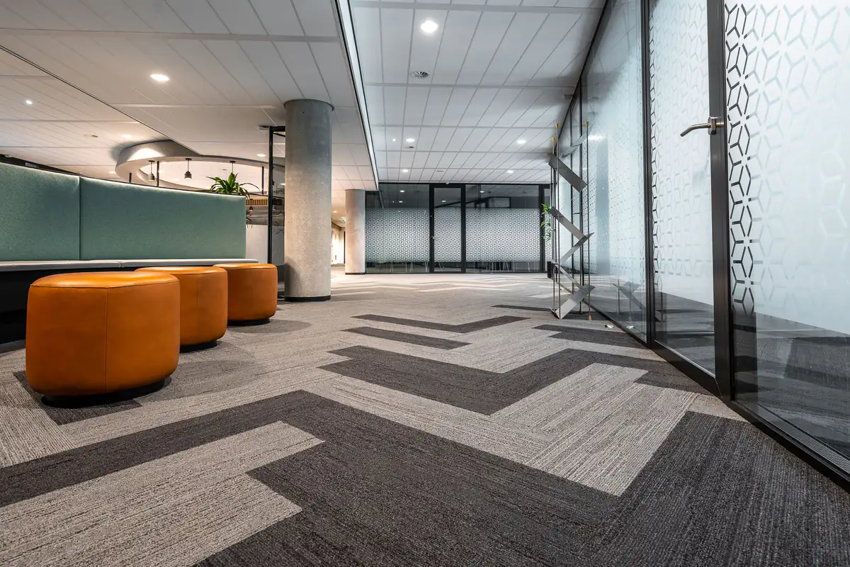 Office carpet tiles | Carpet cleaning in Newcastle Modern office corridor with patterned carpet tiles, commercial carpet cleaning in Newcastle